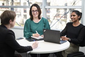 Accelagen team collaborating around a table